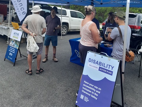 Photo of residents having their say on the Disability Inclusion Action Plan at Yamba Farmers Market in February, 2023.